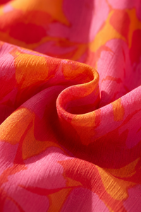 Olympe | Flydende kjole i rosa og orange